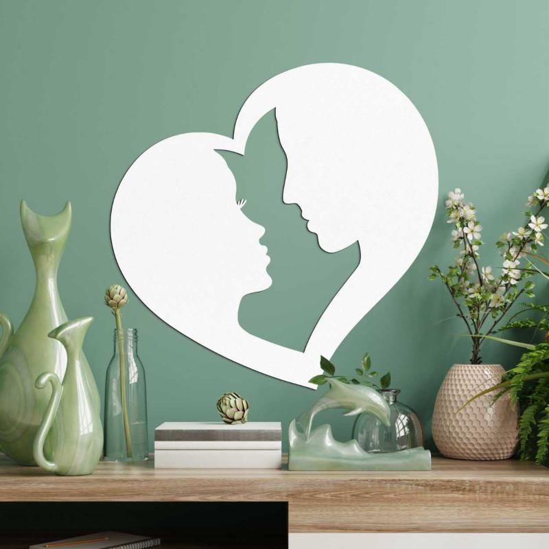 Szív alakú díszítés, amelyben két arc körvonalai kapcsolódnak össze.